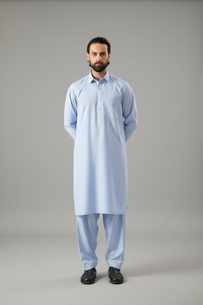 Man wearing a light blue Kameez Shalwar